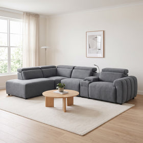 Auburn Corner Lounge in Dark Grey fabric with chaise, adjustable headrests, cup-holder console and channelled arm, in a bright living room