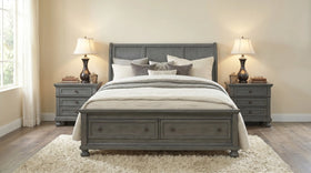 Gray bed with matching nightstands in a bedroom setting.