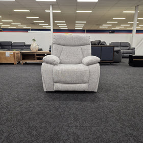Baker recliner chair in light grey fabric seen front on in The A2Z Furniture showroom, showing the single seat cushion and plush scatter armrests