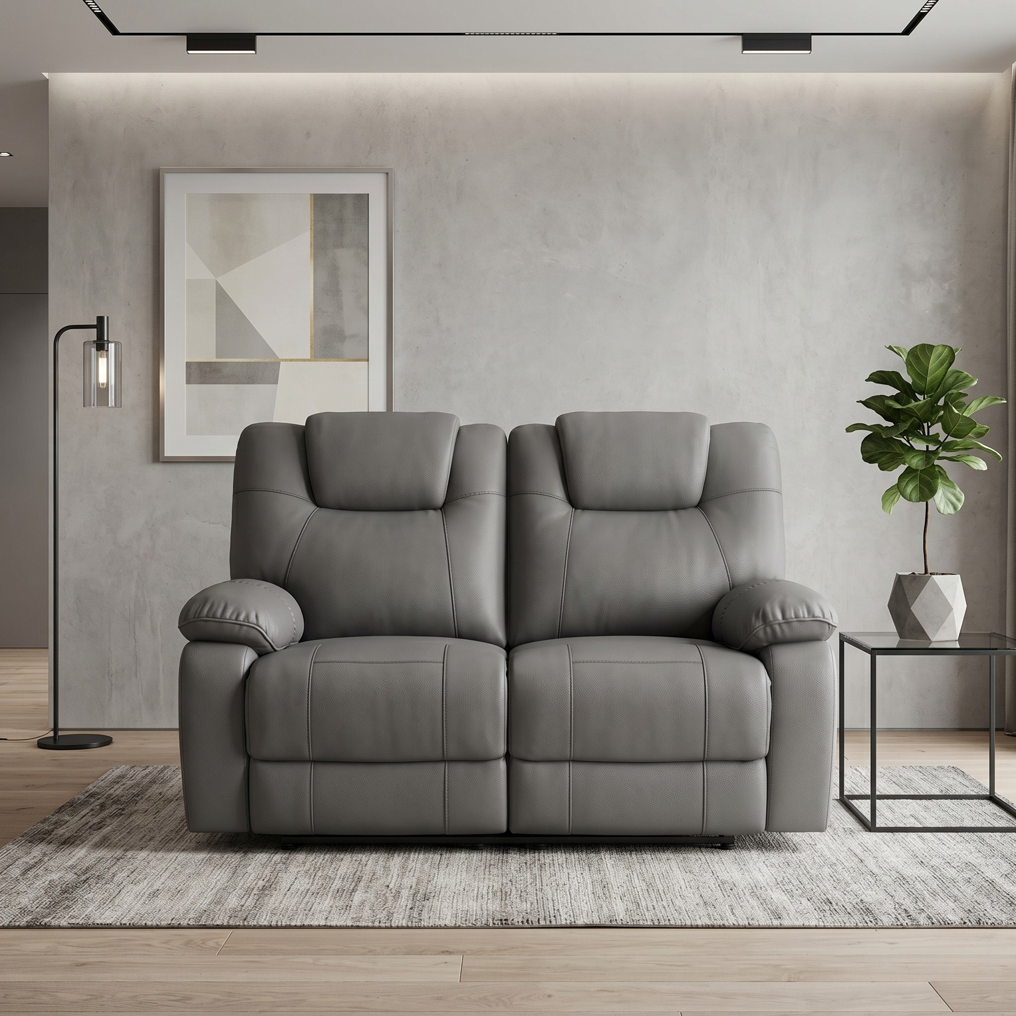 Gray sofa in a modern living room with a plant and abstract art on the wall.
