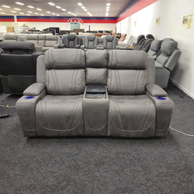 Ballina 2 Seater Electric Recliner Lounge in grey, front view showing both seats, the drop-down centre console and the LED-lit cup holders in the arms, on display in The A2Z Furniture showroom