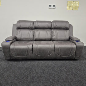 Ballina 3 Seater Electric Recliner Lounge in grey, front view with all three seats upright and the arm cup holders lit, in The A2Z Furniture showroom