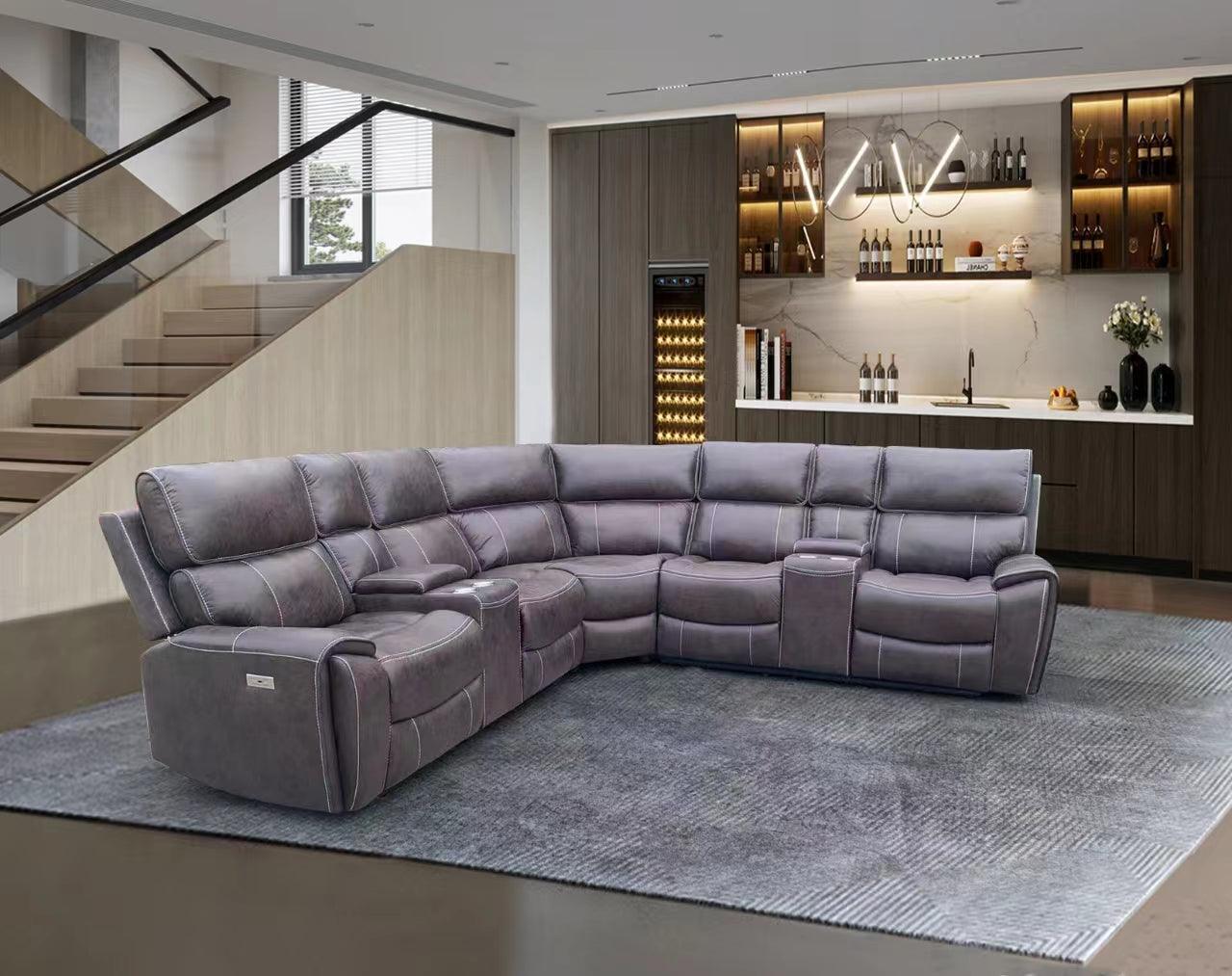 Modern grey sectional recliner lounge sofa in a contemporary living room with bar area