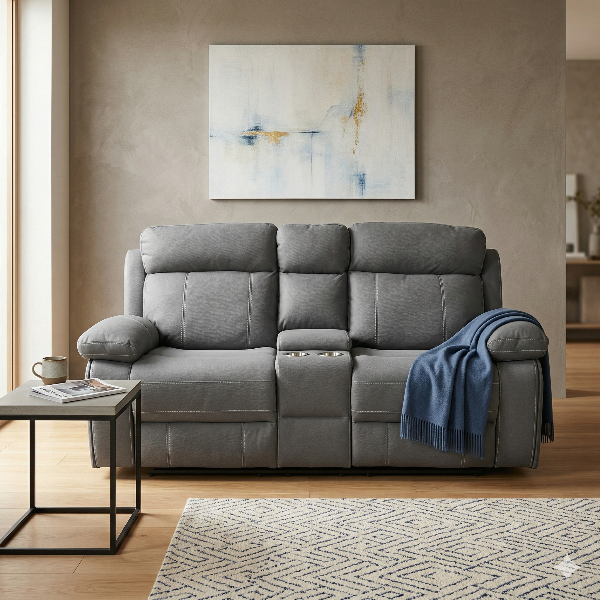 Gray sofa in a living room with a abstract painting on the wall