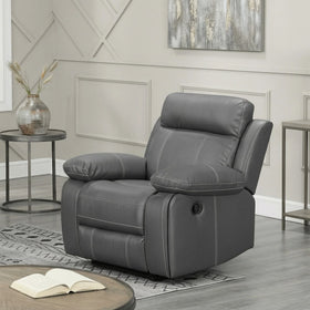 Charcoal recliner chair in a living room setting with decor elements.