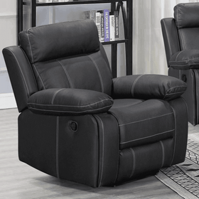 Black leather recliner chair with padded armrests and white stitching in a living room