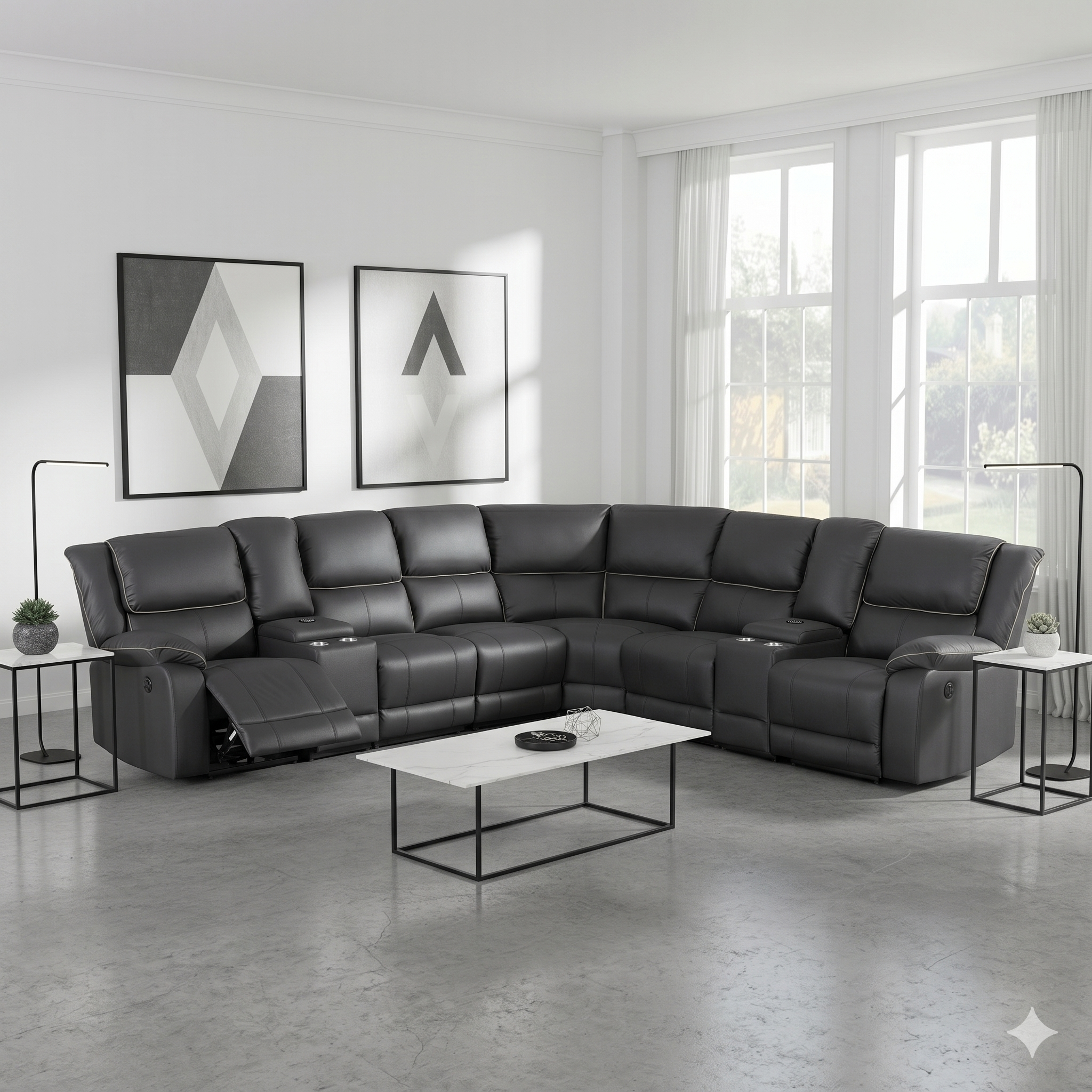 Modern living room with a large black fabric sectional sofa, white coffee table, and decorative wall art.