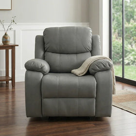 Bliss Recliner Chair in gray leather with plush cushions, placed on wooden flooring near a window, featuring a beige throw draped over one armrest in a cozy living space.