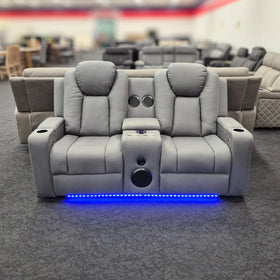 Grey 2 seater electric recliner lounge with cup holders, speakers, and blue LED lights