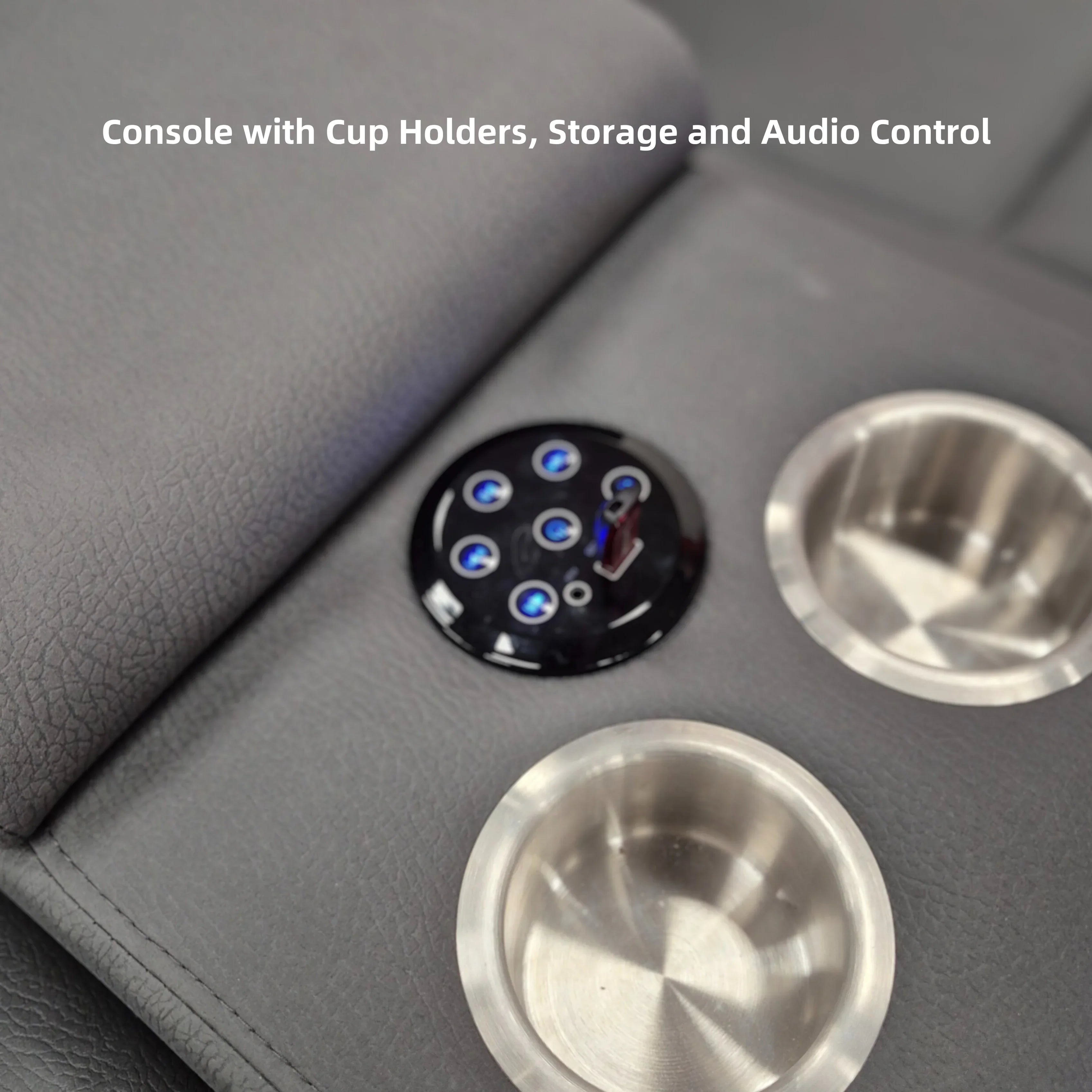 Close-up of grey recliner lounge console with cup holders and audio control panel
