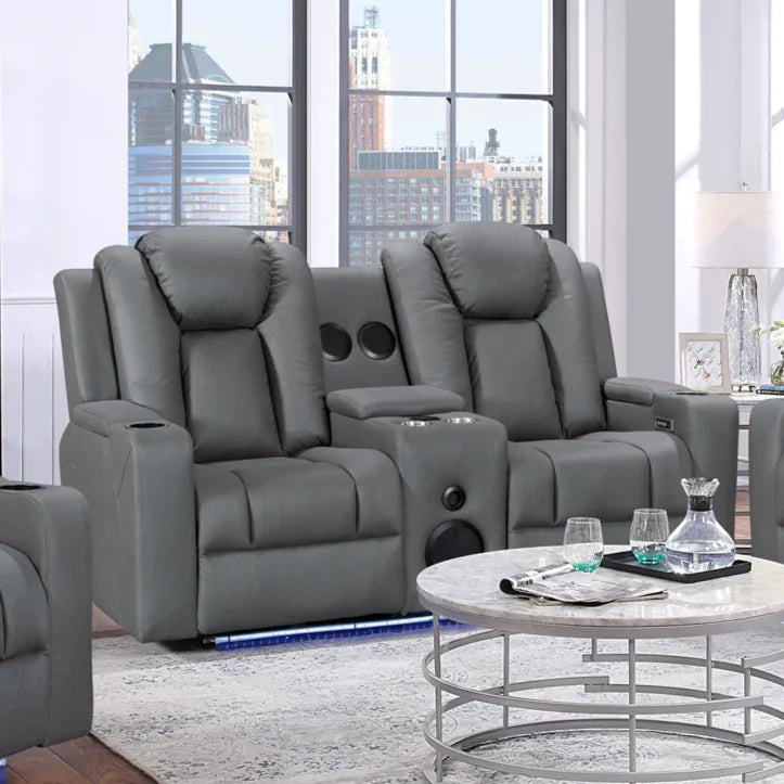 Charcoal grey dual recliner lounge with cup holders and console in a modern living room.