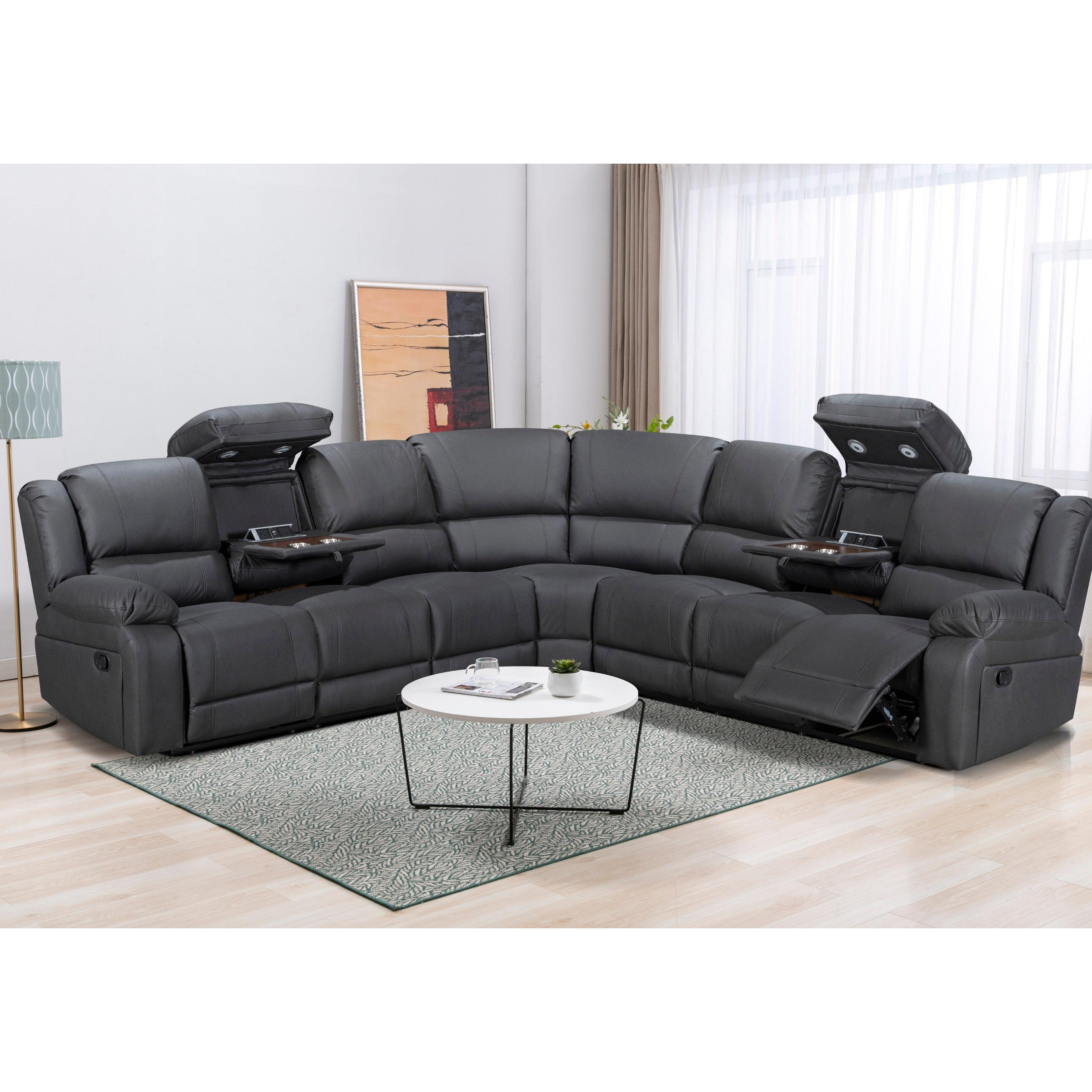 Gray sectional sofa in a living room setting with a coffee table and decor items.