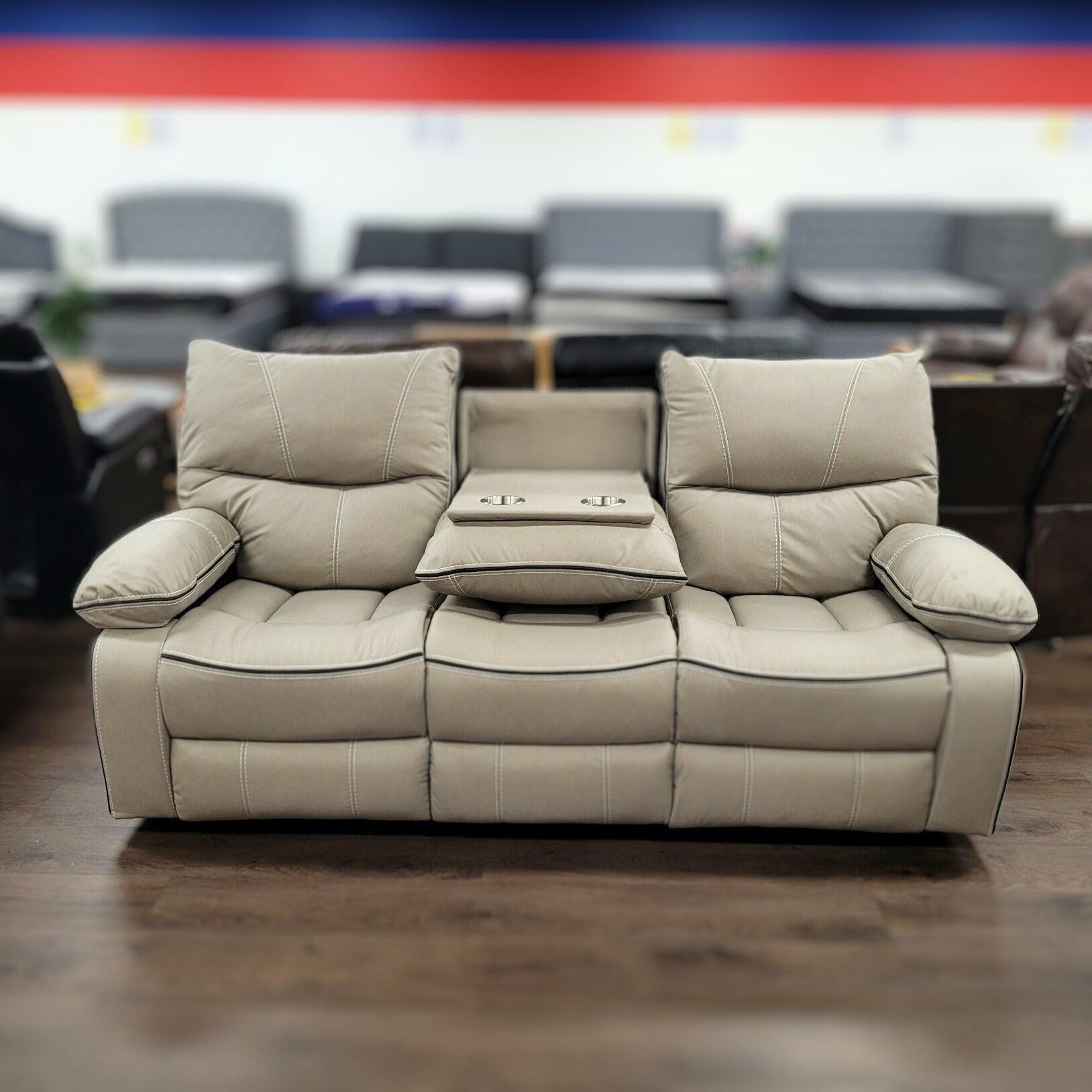 Beige recliner sofa with cup holders on showroom floor, contemporary lounge furniture