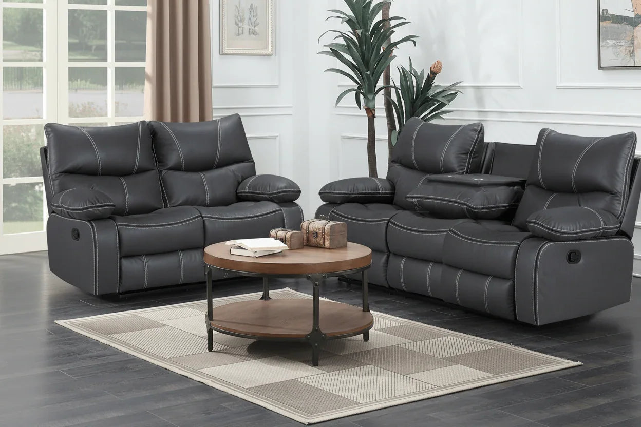 Gray reclining sofa set in a living room with a wooden coffee table.