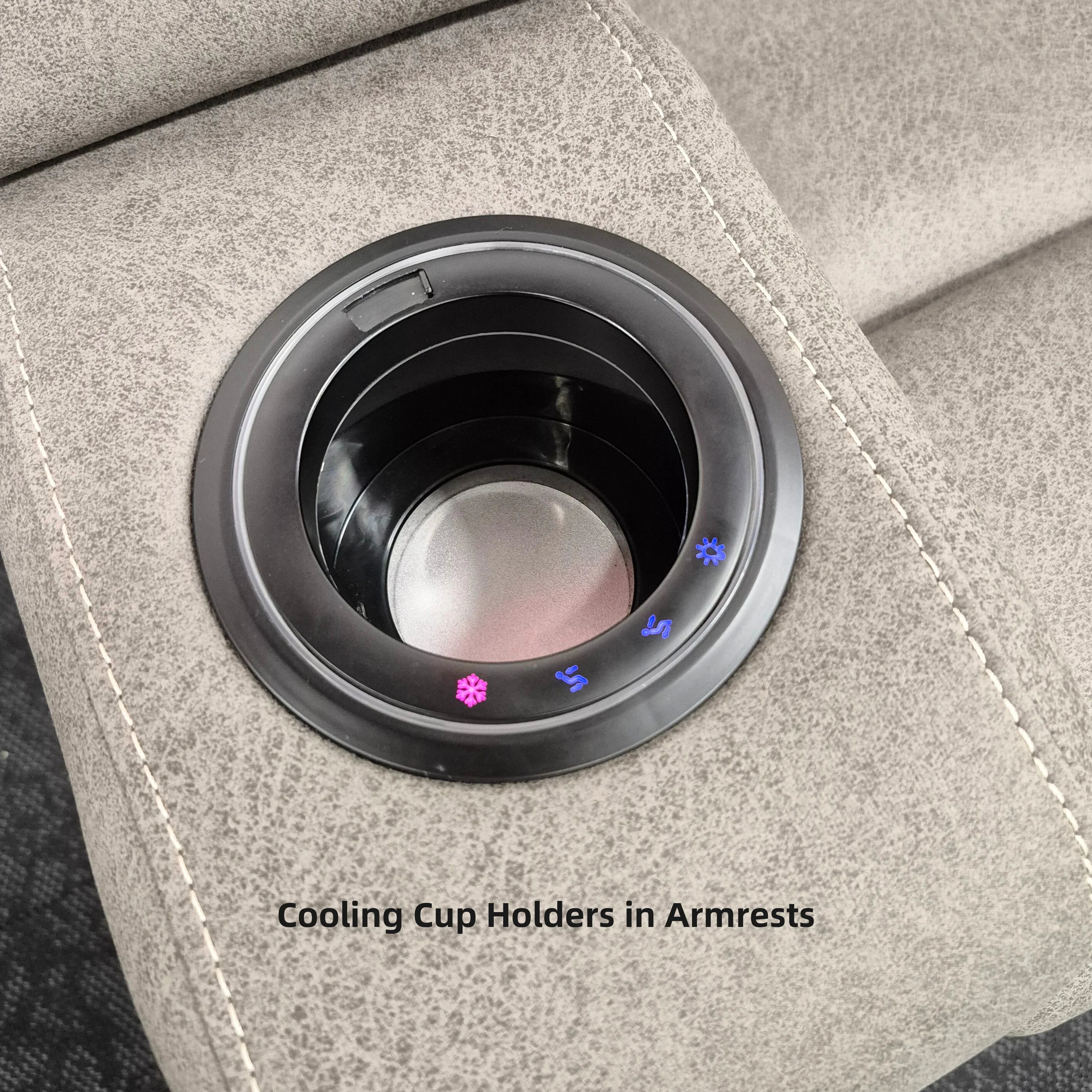 Close-up of electric recliner lounge armrest with built-in cooling cup holder on grey upholstery