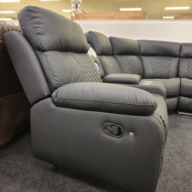 Bunbury black air leather corner recliner sofa - side view of an end reclining seat showing the pull-handle recline release on the outer arm