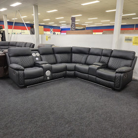 Bunbury black air leather corner recliner sofa with diamond-quilted stitching, seats upright and LED lighting off, at The A2Z Furniture showroom