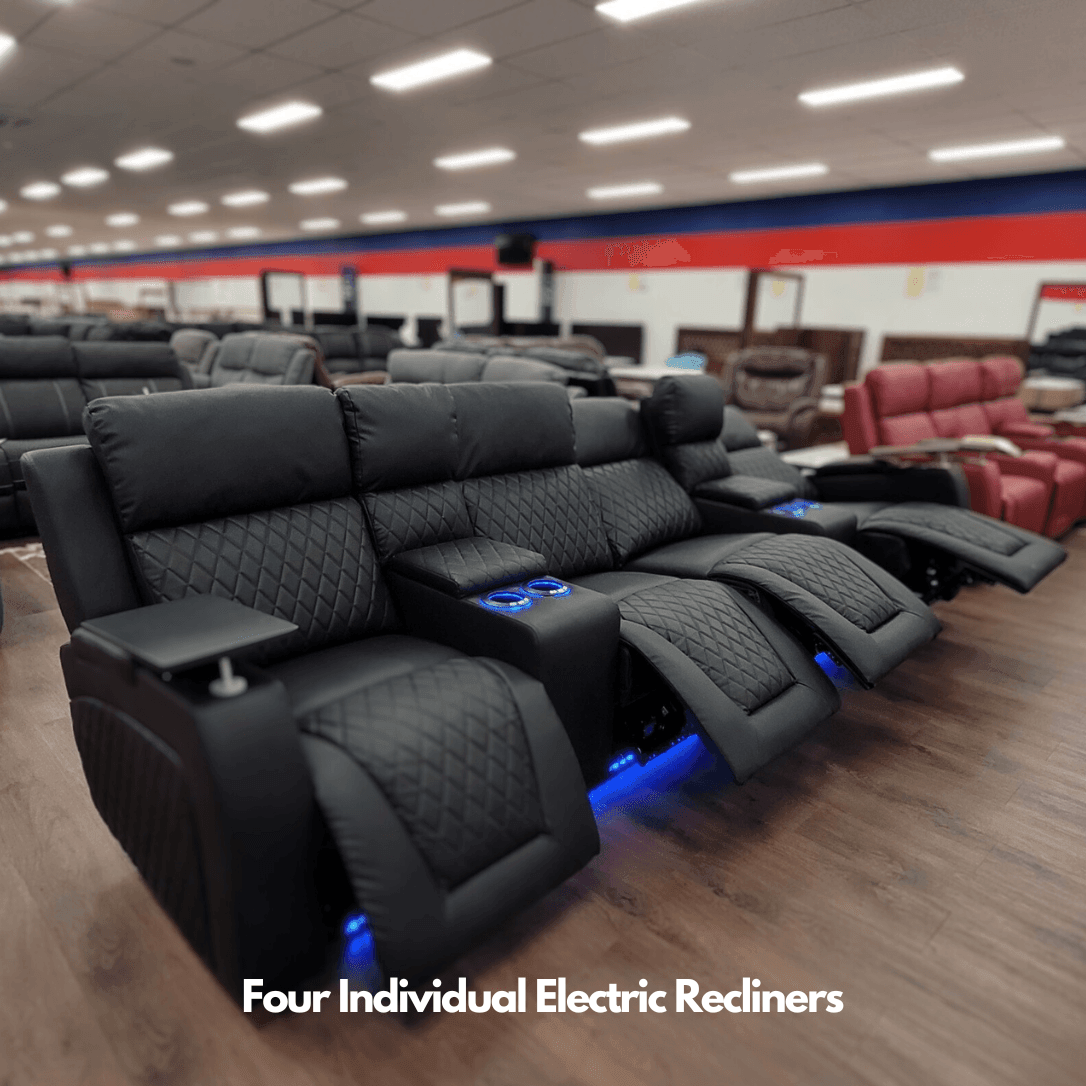 Black four-seat electric recliner sofa with cup holders and LED lights in furniture showroom