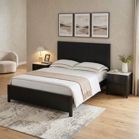 Caulfield black fluted bed frame, angled view in a warm bedroom with a matching two-drawer bedside table - The A2Z Furniture