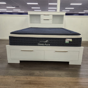 Camira Bookcase Bed Frame in white finish, full showroom view showing headboard open shelving with centre drawers and footboard storage drawers, at The A2Z Furniture showroom. Mattress shown is not included.