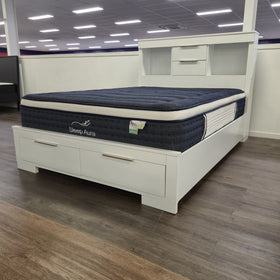 Camira Bookcase Bed Frame in white finish, side showroom view at The A2Z Furniture showroom. Mattress shown is not included.
