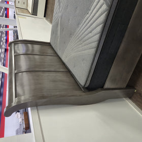 Canada Bed Frame in grey on The A2Z Furniture showroom floor, angled view of the footboard storage drawers beside a matching nightstand.