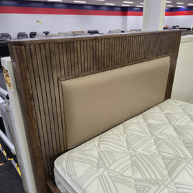 Cannon Gas Lift Bed Frame with the base lifted open showing the internal storage compartments, walnut-finish timber frame — The A2Z Furniture showroom. Mattress and bedding shown are not included.
