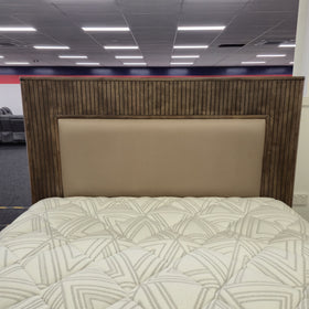 Close-up of the Cannon Gas Lift Bed Frame's upholstered taupe headboard panel with slatted walnut-finish timber surround — The A2Z Furniture showroom.