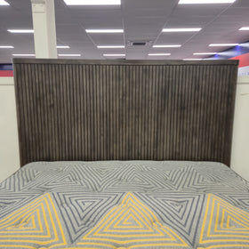 Close-up of the Cape Town Bed Frame headboard showing the full-height dark grey ribbed timber slats