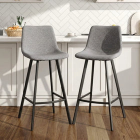 Cardiff Bar Stools in grey fabric with black steel legs at a white kitchen bench
