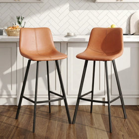 Cardiff Bar Stools in orange-tan with black steel legs at a white kitchen bench