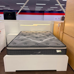 Carinda white gloss gas lift bed frame, front view with the built-in headboard LED strip lit - The A2Z Furniture showroom