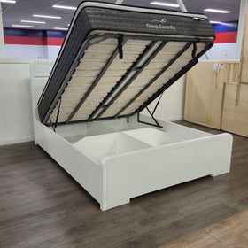 Carinda white gloss gas lift bed frame, wider view of the base lifted open with the storage cavity and centre divider visible - The A2Z Furniture showroom