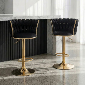 Casablanca Bar Stools in black velvet with woven backrests and gold gas lift bases at a stone bar
