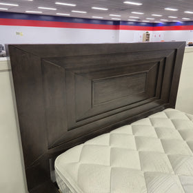Angled corner detail of the Chandler Floating Bed Frame headboard in a dark espresso timber finish, showing the mitred frame layers and reeded centre panel, in The A2Z Furniture showroom.