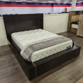 Angled view of the Chandler Floating Bed Frame in a dark espresso timber finish on display in The A2Z Furniture showroom, showing the low platform base and brass-tone inlay detail. Mattress shown is not included.