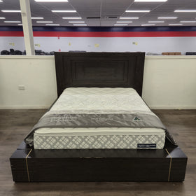 Chandler Floating Bed Frame in a dark espresso timber finish viewed from the foot of the bed in The A2Z Furniture showroom, showing the panelled headboard and ribbed base rail with brass-tone inlay strips. Mattress shown is not included.