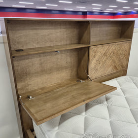 Cleveland Bookcase Bed Frame headboard with a hinged parquet door opened, showing the concealed storage compartment and open shelf cubbies, on display in The A2Z Furniture showroom. Mattress shown is not included.