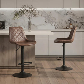 Cobalt Bar Stools in brown with diamond-stitched seats and black gas lift bases at a kitchen island