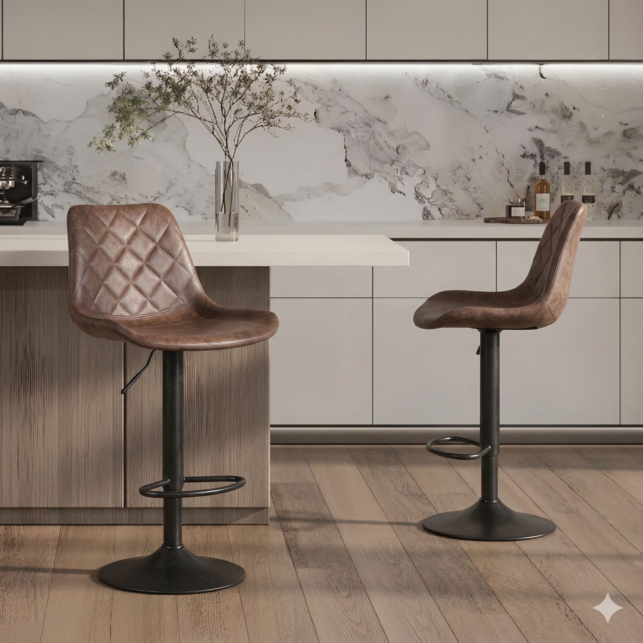 Modern kitchen with two brown leather bar stools and marble backsplash