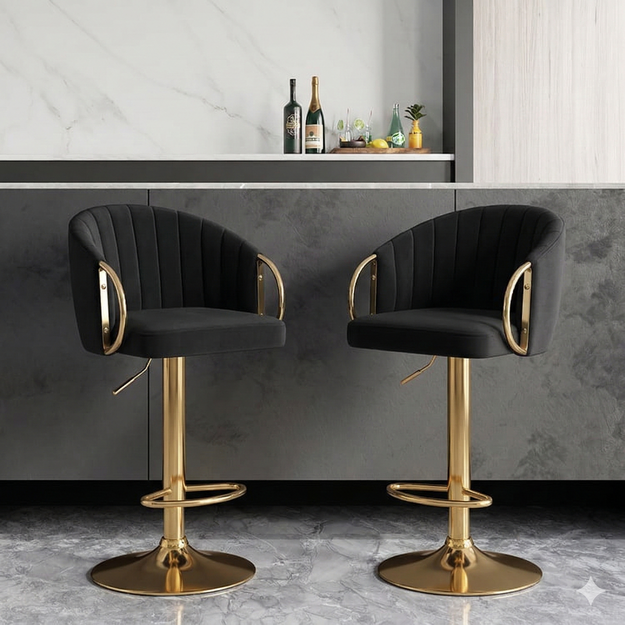 Two black bar stools with gold bases in a modern kitchen setting.