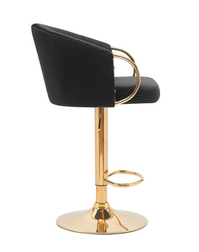 Modern black velvet bar stool with gold metal base and curved armrests, side view