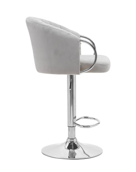 Modern grey velvet bar stool with chrome base and padded backrest, side view