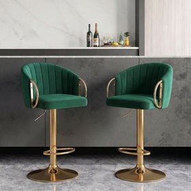 Columbia Bar Stools in green velvet with channel-stitched backrests and gold gas lift bases at a home bar