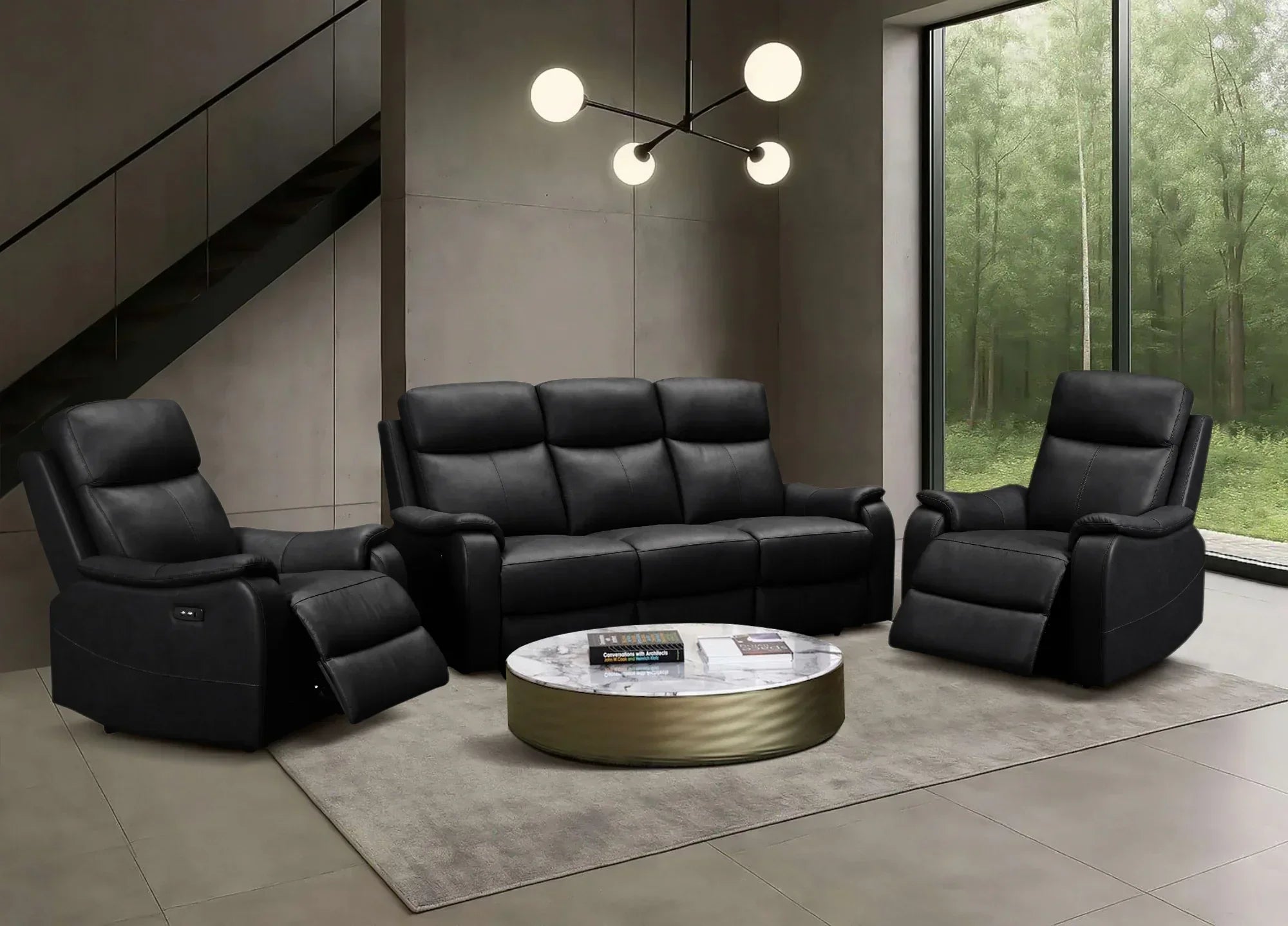 Modern living room with black leather sofa and recliners near a large window with greenery.