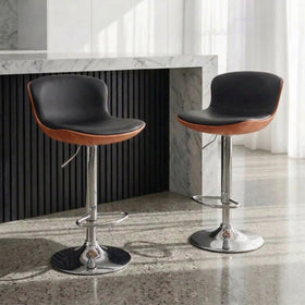 Cosmo Bar Stools with black PU leather seats, walnut-look shells and chrome gas lift bases at a marble breakfast bar