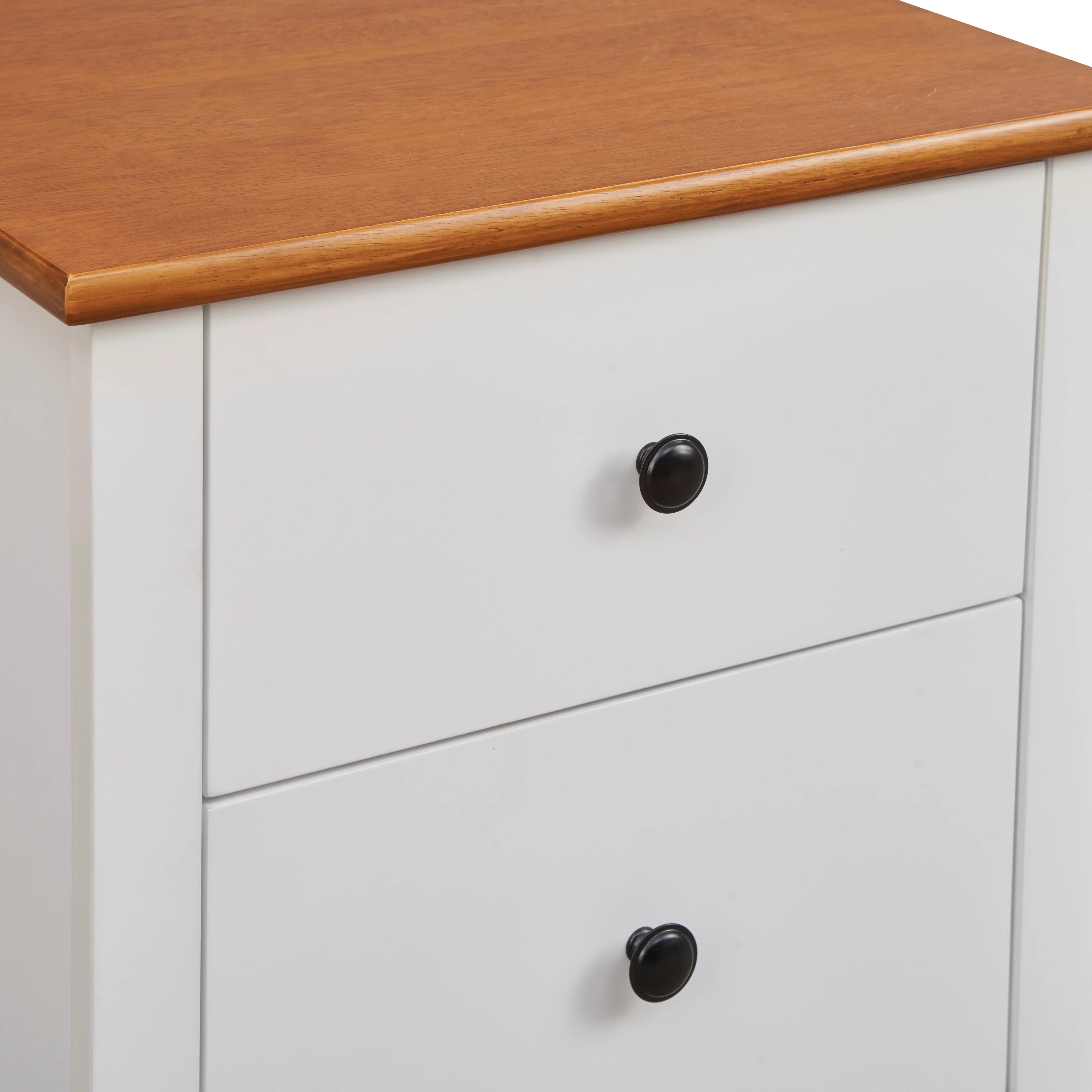 White bedside table with two drawers and wood top, black knobs, modern bedroom furniture
