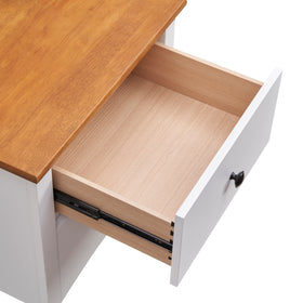 Open white wooden drawer with black knob and natural wood top, close-up view