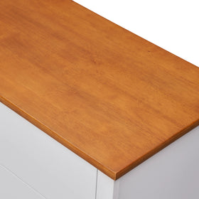 Wooden top and white drawers of a modern dresser, bedroom storage furniture