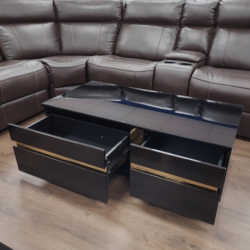 Dakota Coffee Table from The A2Z Furniture - black MDF structure with gold accents, black tempered glass top, and 2 storage drawers